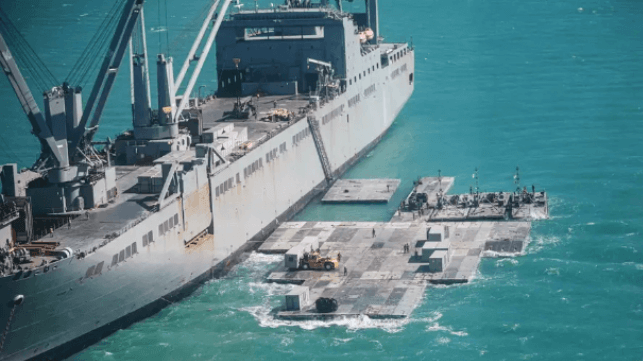Assembling a floating pier from a sealift ship (U.S. Navy file photo)