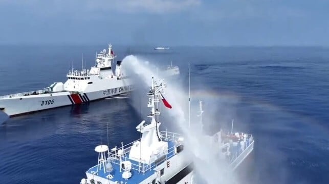 A China Coast Guard cutter water-cannons a Philippine patrol vessel (PCG file image)