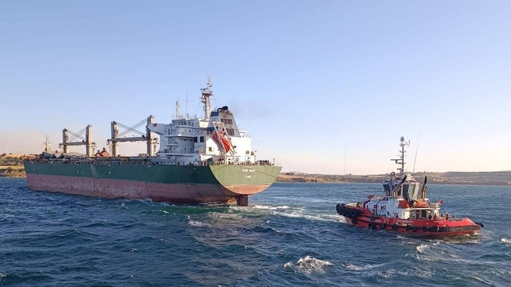 Turkish tug towing stranded bulker
