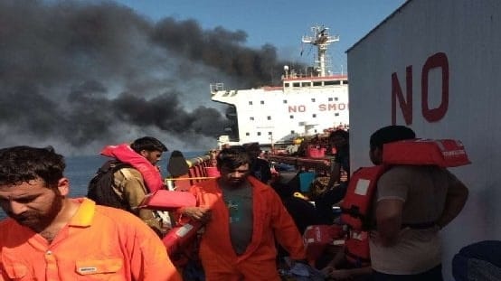 seafarers abandoning ship after attack near Strait of Hormuz
