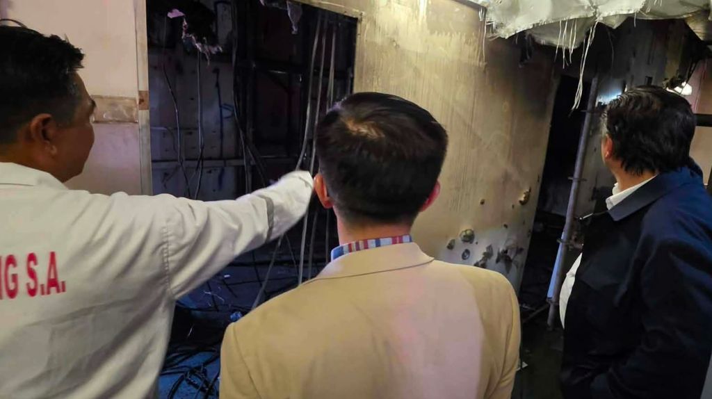 Philippine officials tour the damage to a merchant vessel that was hit in a drone attack in the Black Sea, August 2026 (DMW)