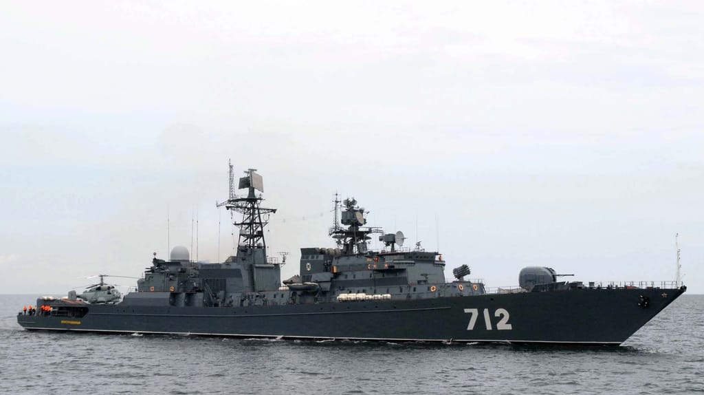 Neustrashimy and her embarked helicopter in friendlier times, exercising alongside NATO forces in the Baltic, 2008 (USN file image)