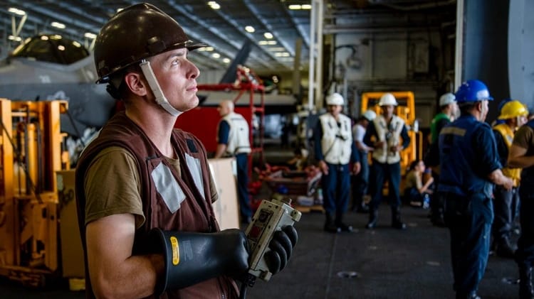Seaman Bailey Szramowski during an UNREPS evolution aboard USS Abraham Lincoln, 2022, several months before the events in the case (USN)