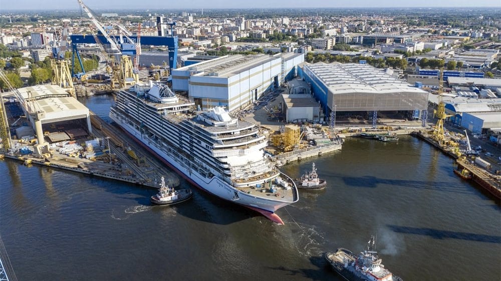 cruise ship leaving building dock