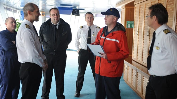 inspectors on the bridge of a cruise ship