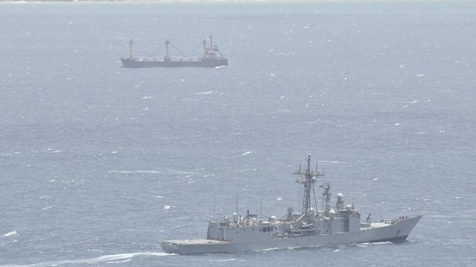 warship monitoring hijacked vessel