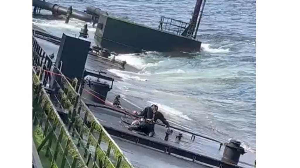 Salvor at work on the oily, inclined deck of the Caroline Bezengi (supplied)