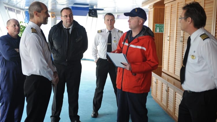 inspectors on the bridge of a cruise ship