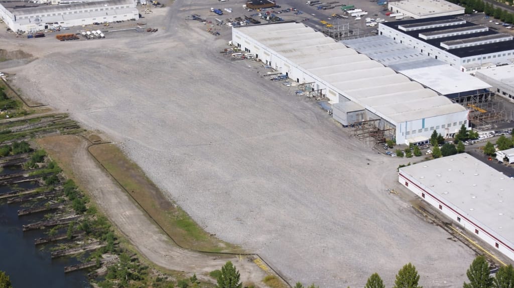 The original Kaiser assembly sheds, upper right, are home to New Pacific's operations. The old yard's slipways, far left, can still be discerned (New Pacific)