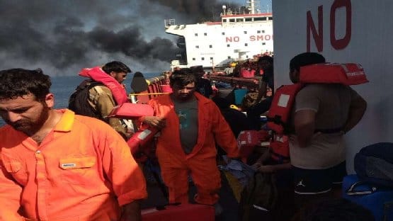 seafarers abandoning ship after attack near Strait of Hormuz