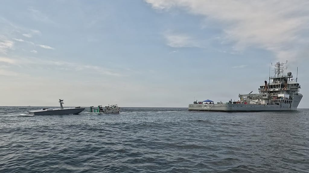 A T38 drone approaches a towed refueling sled deployed by USNS Vindicator (USN)