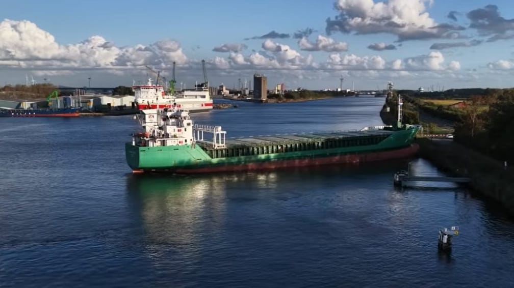 cargo ship aground on canal embankment