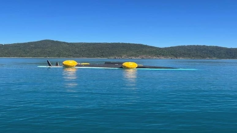 capsized racing yacht