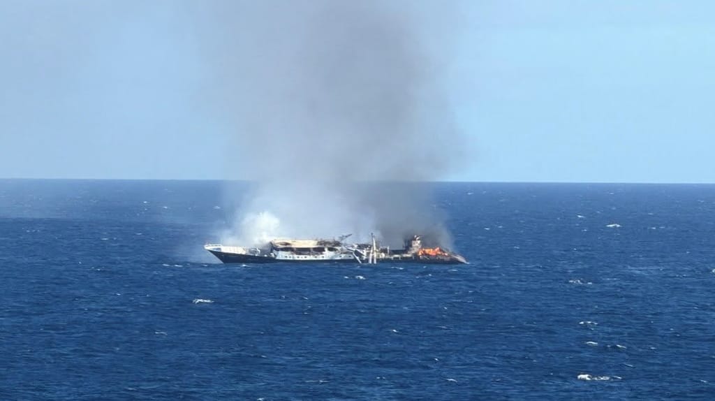 Drennec, her mast collapsed, burns off the Galapagos (USCG)