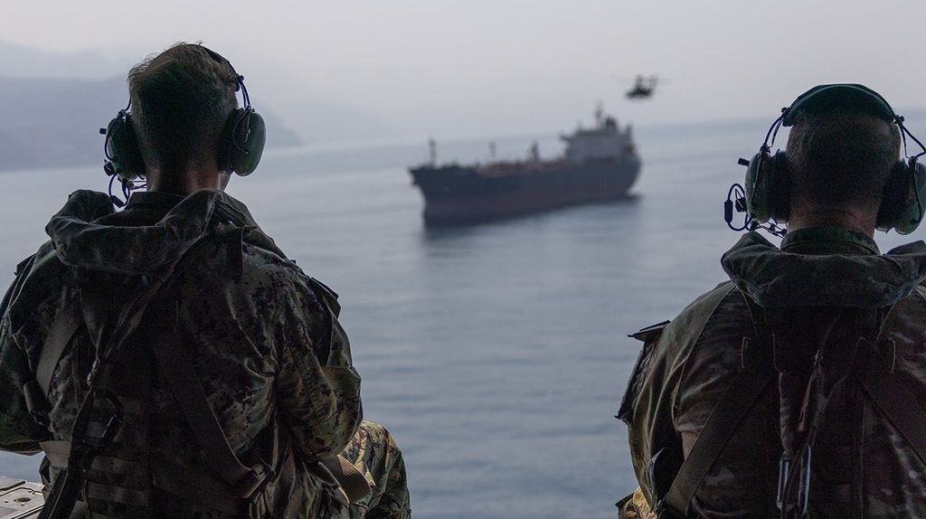 Admiral Cooper overflying an unidentified bulk carrier in the Strait of Hormuz (CENTCOM)