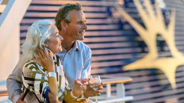 couple on rail drinking wine