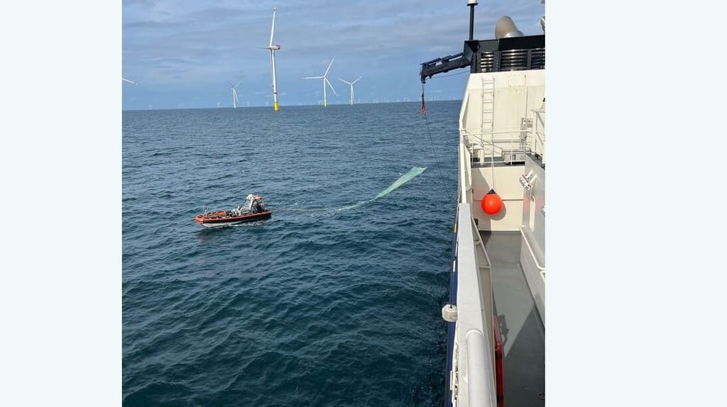 wind turbine blade being retrieved in North Sea