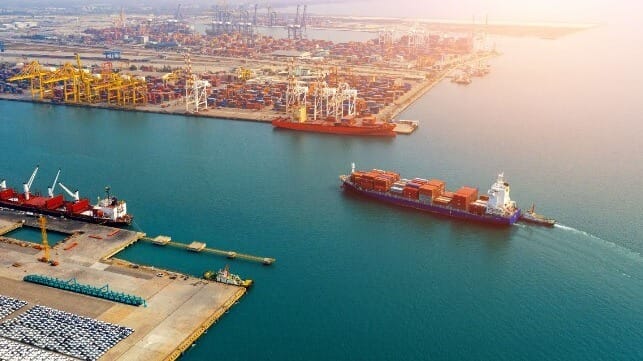 Aerial view of container ship entering port
