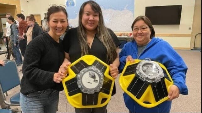 Staff holding buoys