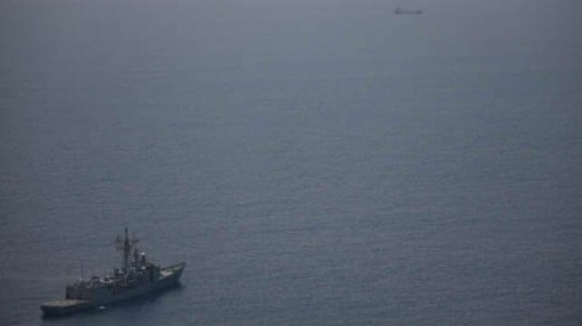 warship monitoring hijacked vessel