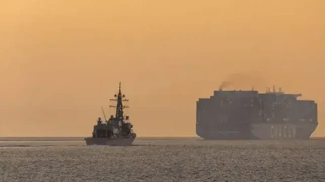 Japanese destroyer JS Yudachi and a merchant vessel navigating the Malacca Strait during regional presence deployment in February 2026 (Abdus Chowdhury/Defence Imagery)