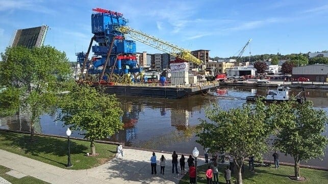 Giant portal crane "Big Blue" (P-82) passes through downtown Manitowoc (Mayor Justin Nichols)