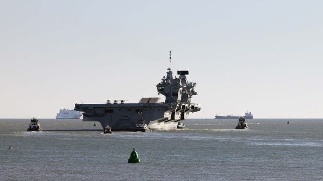 HMS Prince of Wales departs with tug assistance