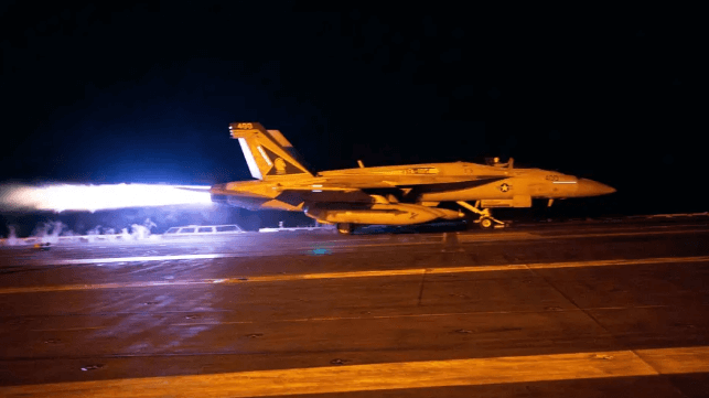 A U.S. Navy F/A-18 fighter takes off from the carrier USS Dwight D. Eisenhower in the Gulf of Aden, January 12 (USN)