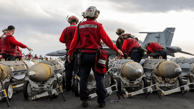 Crewmembers aboard USS Harry S. Truman prepare JDAM bomb loadout for strikes on Houthi positions, Apr. 7 (USN)