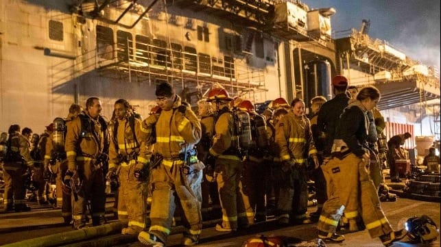 Sailors combat a fire aboard the amphibious assault ship USS Bonhomme Richard, July 13 (USN)