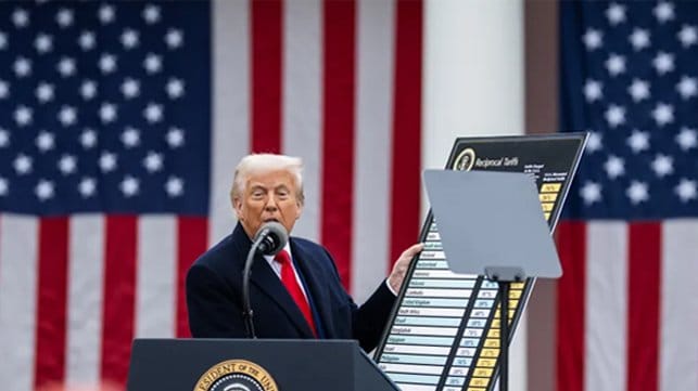 Trump holding tariff display