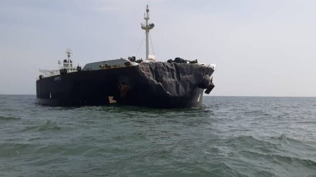 Damaged oil tanker with a crumpled bow
