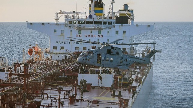 Royal Marines board the shadow fleet tanker Smyrtos, with HMS Sutherland alongside