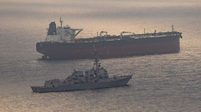 Guided-missile destroyer USS Rafael Peralta (DDG 115) enforces the U.S. blockade on Iranian ports against an Iranian-flagged ship attempting to sail to a port in Iran, April 24.