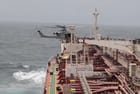 U.S. Marines fast rope onto the deck of the product tanker Charminar (USMC / Central Command)