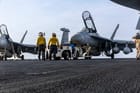 Sailors at work on the flight deck of USS Abraham Lincoln, July 30 (USN)