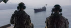 Admiral Cooper overflying an unidentified bulk carrier in the Strait of Hormuz (CENTCOM)