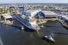 cruise ship leaving building dock