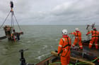 removal of masts from WWII wreck