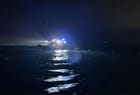 search for missing woman and child after boat was run over by cargo ship