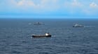 New Zealand warships monitoring vessel
