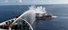 Taiwan Coast Guard firing water cannon on Chinese fishing vessel