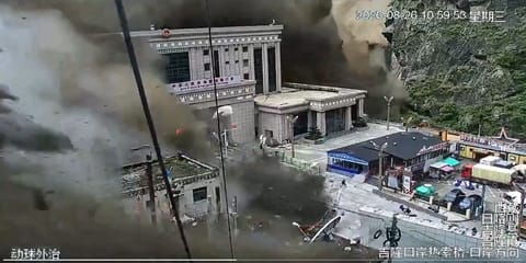 Water, mud and flying rocks engulf the Gyirong border post (Chinese social media)