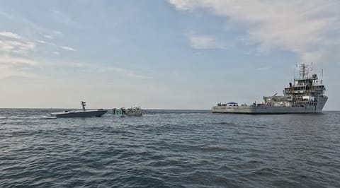 A T38 drone approaches a towed refueling sled deployed by USNS Vindicator (USN)