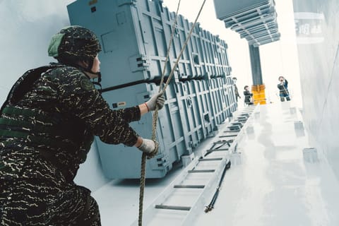 Servicemembers load antiship missiles aboard an Anping-class patrol vessel (Taiwan Ministry of National Defense file image)