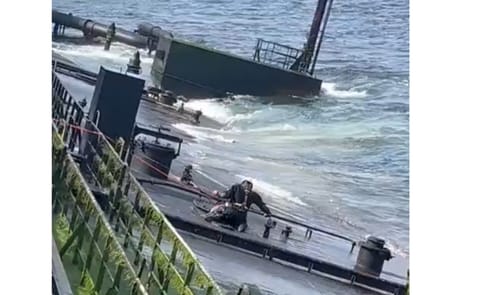 Salvor at work on the oily, inclined deck of the Caroline Bezengi (supplied)