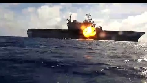 An unmanned bomb boat hits the former USS Peleleiu during a sinking exercise at RIMPAC 2026 (USN)