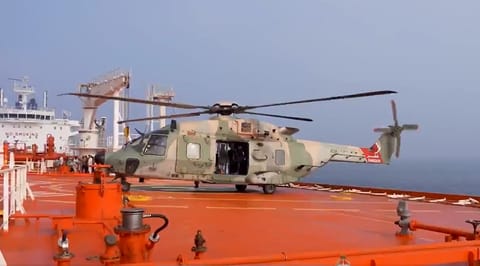 An Omani Air Force helicopter lands aboard On Peace to medevac injured seafarers (Oman MOD)