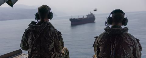 Admiral Cooper overflying an unidentified bulk carrier in the Strait of Hormuz (CENTCOM)