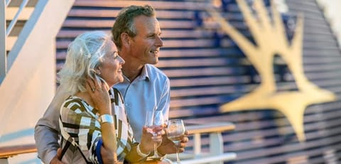 couple on rail drinking wine